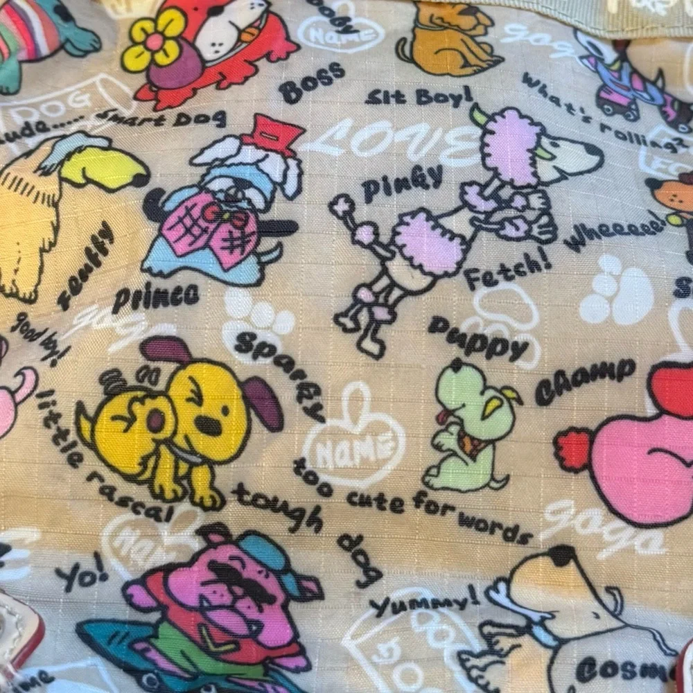 Puppy Love Purse with 2 top zippers and sm side zip.
Cream with bone zip pulls - Picture 9 of 10